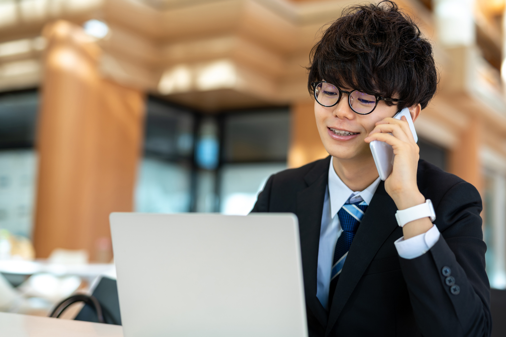 Japanese man talking on the phone.