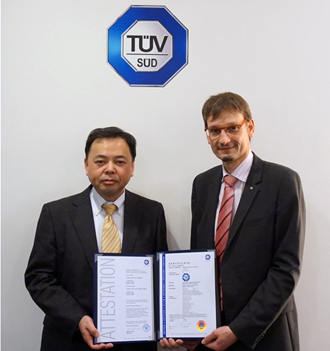 Fig.2 	At Ceremony of certification for nv-safety series type1s.held at 28th Jan. Mr. Kusakabe Technical General Manager (Left) Instrument Components Business Unit, Security & Automation Systems Division, Social Infrastructure Systems Company, Toshiba Corporation. Dr.Stange ( Right), President & CEO of TÜV SÜD Japan Ltd. 