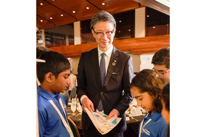 Winning team members showcasing the team’s idea